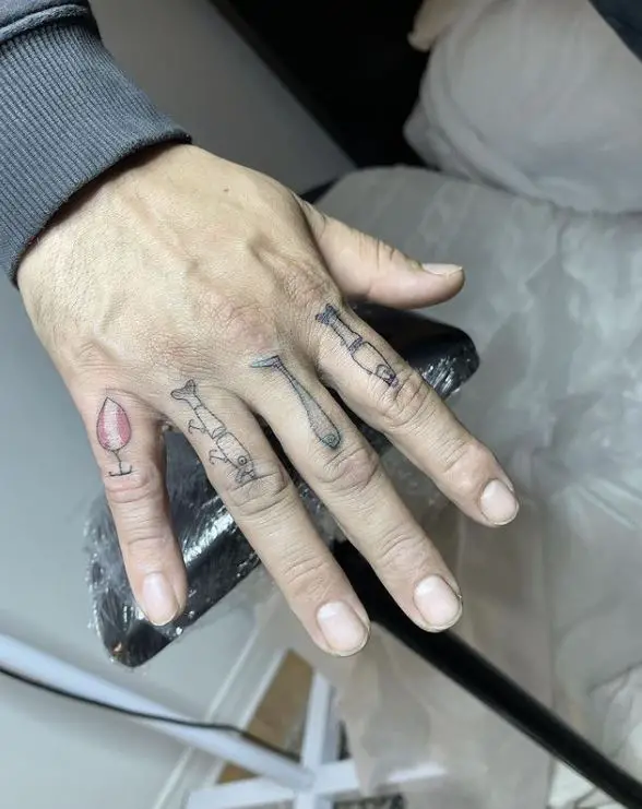 fishing lure tattoos on fingers