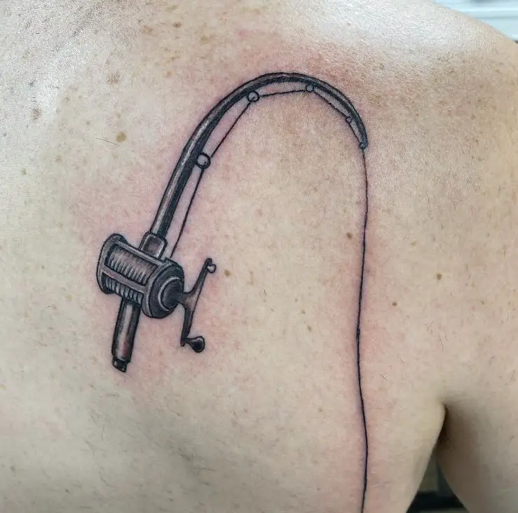 fishing rod tattoo on the shoulder