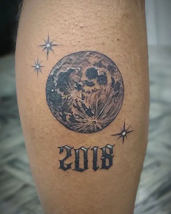 full moon tatoo with stars and year