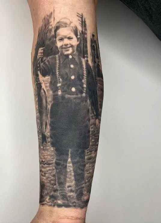 memorial tattoo of a child holding a fish