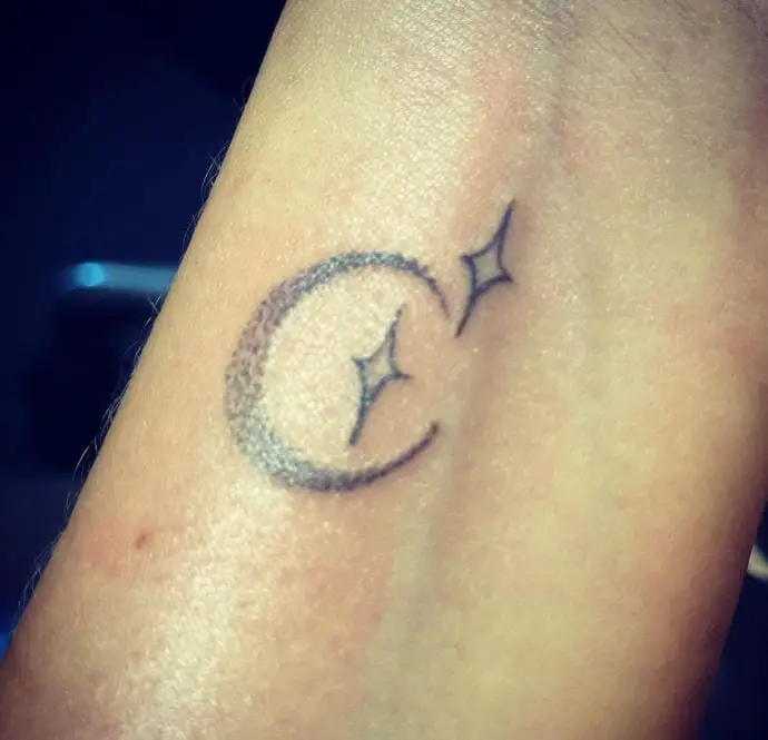 miniature moon and stars tattoo