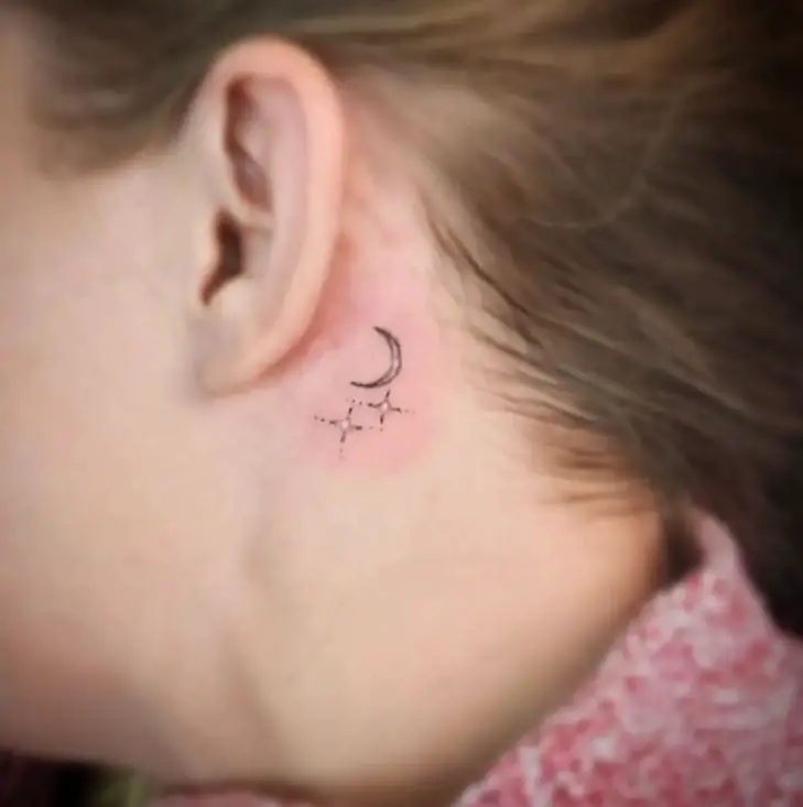 moon and stars tattoo behind the ear
