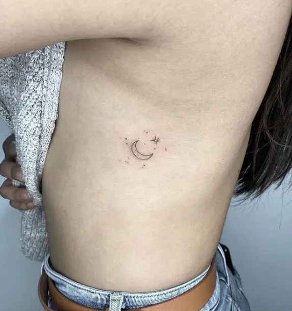 moon and stars tattoo on the ribs