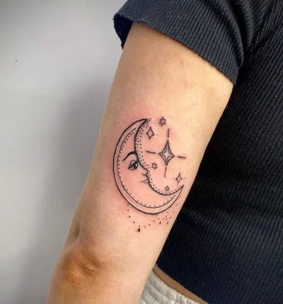 moon face tattoo with stars