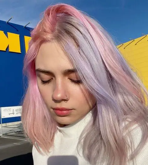 pastel pink and purple highlights on blonde hair