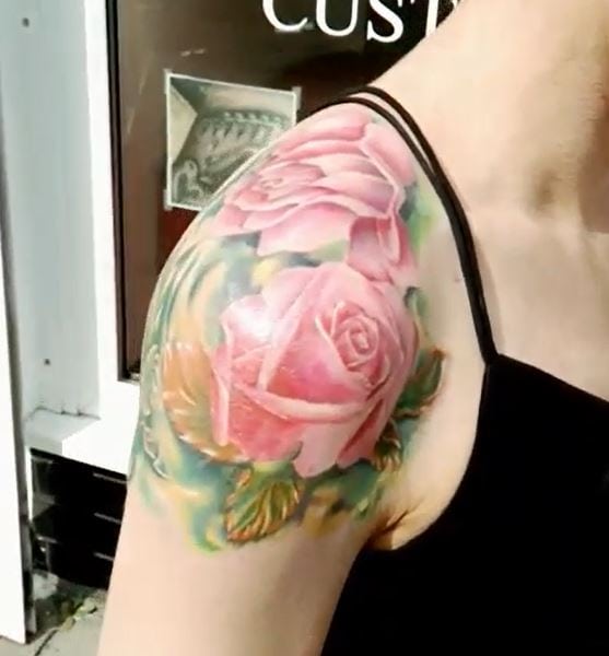 pink roses shoulder tattoo