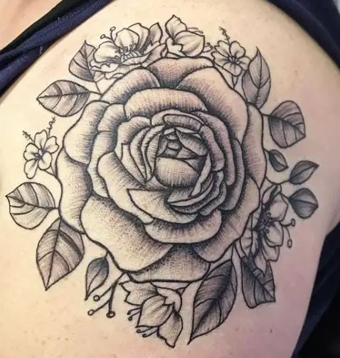 shoulder cap roses tattoo