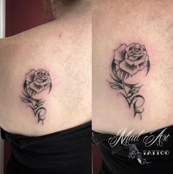 simple dot work rose tattoo
