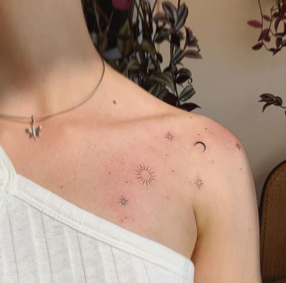 small moon and big stars tattoo on the shoulder