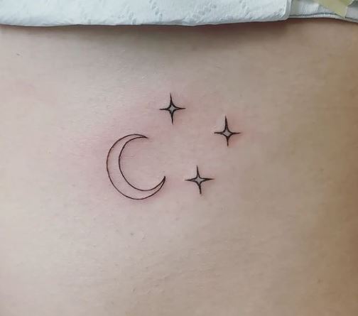 small moon and stars line tattoo