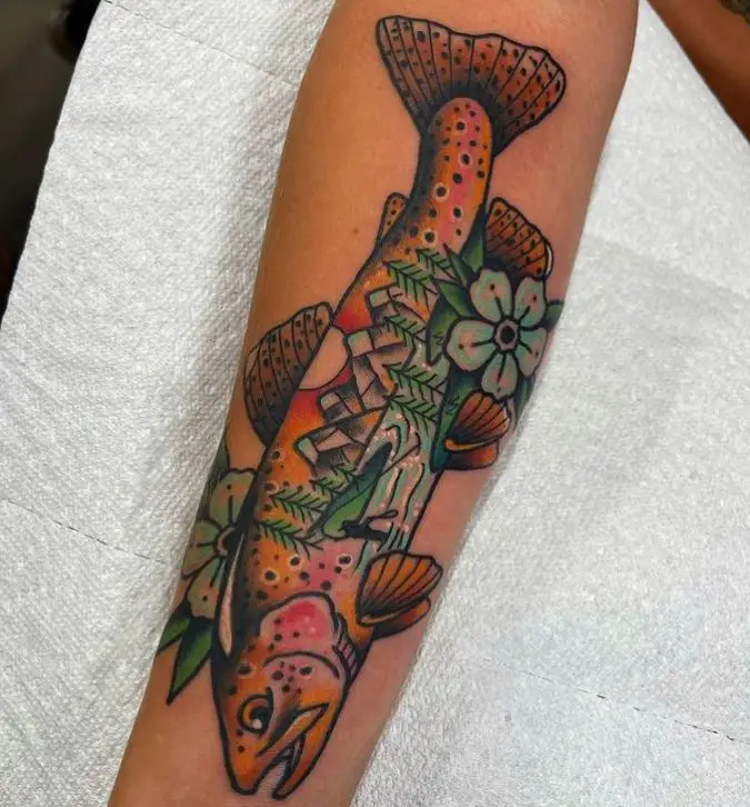 tattoo of a trout fish with a mountain scene
