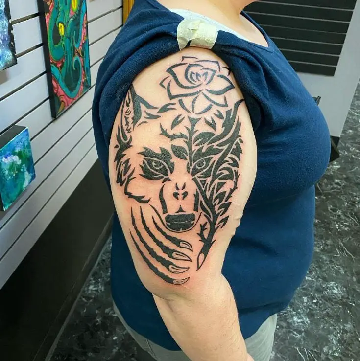 tribal wolf and rose shoulder tattoo
