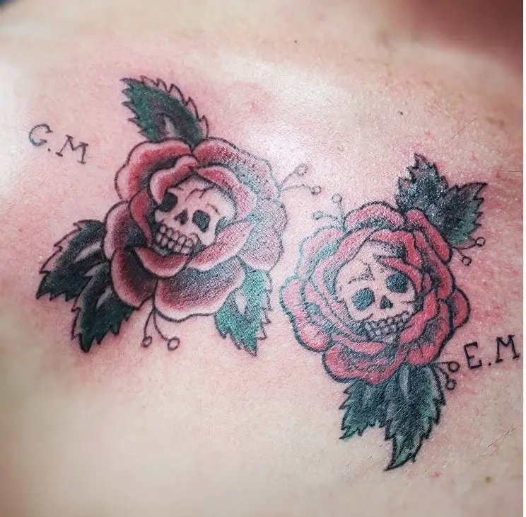 two skull within a rose tattoos