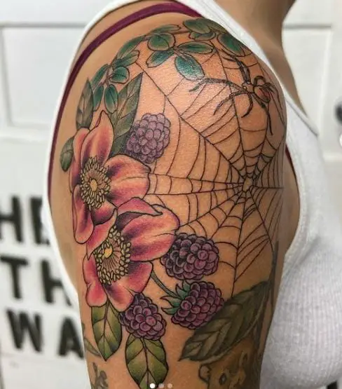 wild roses and spider web tattoo