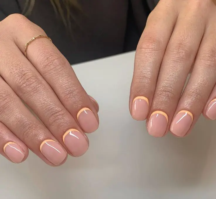 yellow and nude reverse french manicure