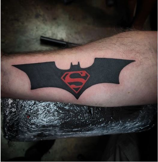 Tattoo of a BatMan, Superman Logo 