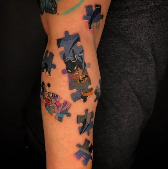 Batman puzzle tattoo on the leg