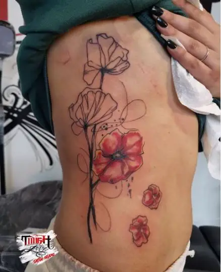 Beautiful line tattoo of poppies