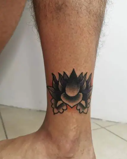 Black Inked Lotus Flower Tattoo On The Leg