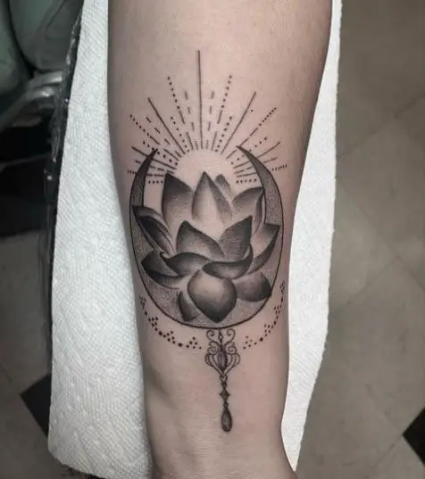 Black and Gray Lotus Art On Curve Of The Arm