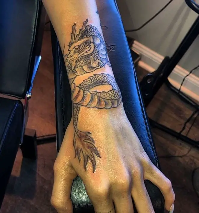 Cool dragon wrist tattoo