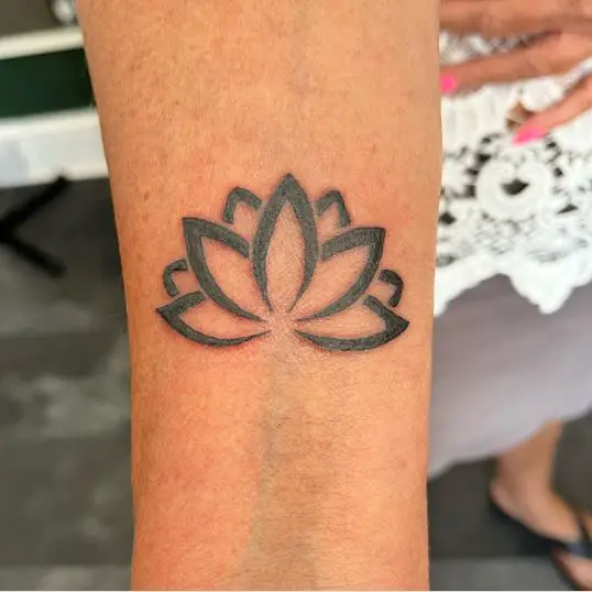 Thick lotus tattoo on wrist