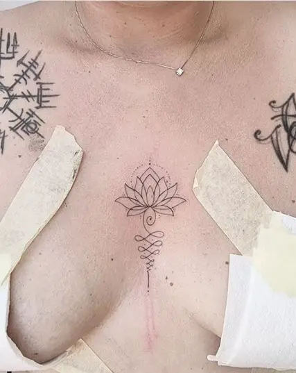 Fine Line Lotus Tattoo On Bust