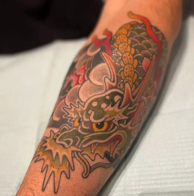 Japanese band dragon tattoo on forearm