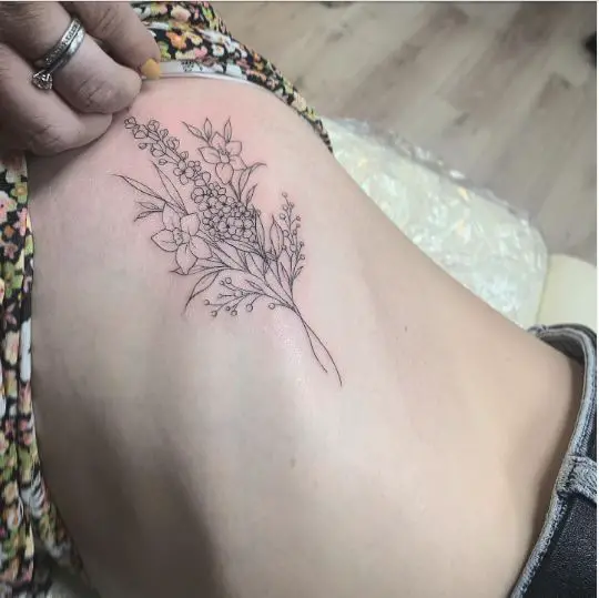 Linework birth flowers rib tattoo