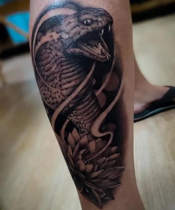 Lotus and cobra tattoo