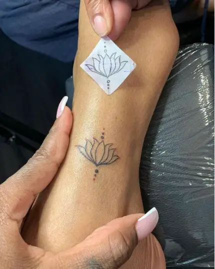 Lotus flower tattoo on ankle
