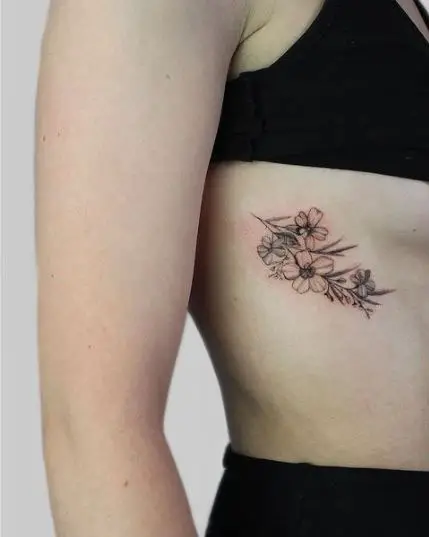 Life in Ink - Baby flower rib tattoo #tattoo #tattoos... | Facebook