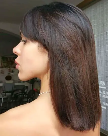 Medium length dark brown hair with highlights