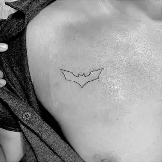 batman symbol tattoo on wrist