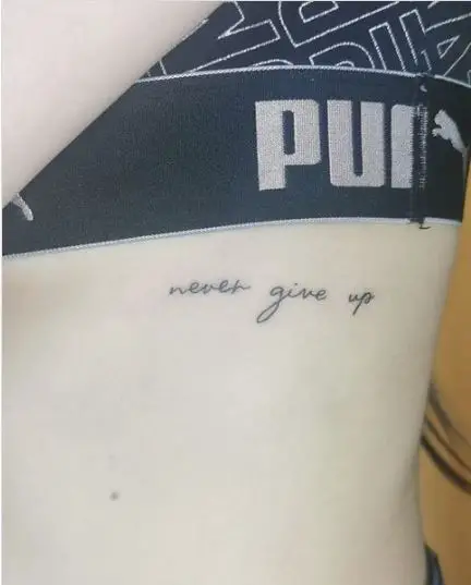 Never Giveup Quote Tattoo