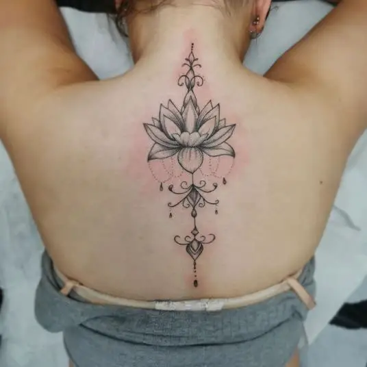 Ornamental Lotus Flower Spine Tattoo