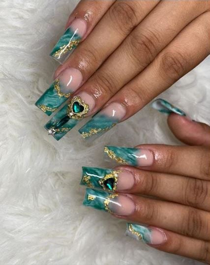 Emerald nails with heart-shaped stone