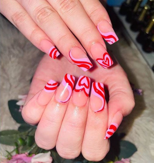 Pink Nails with Red Stripes and a Heart Design