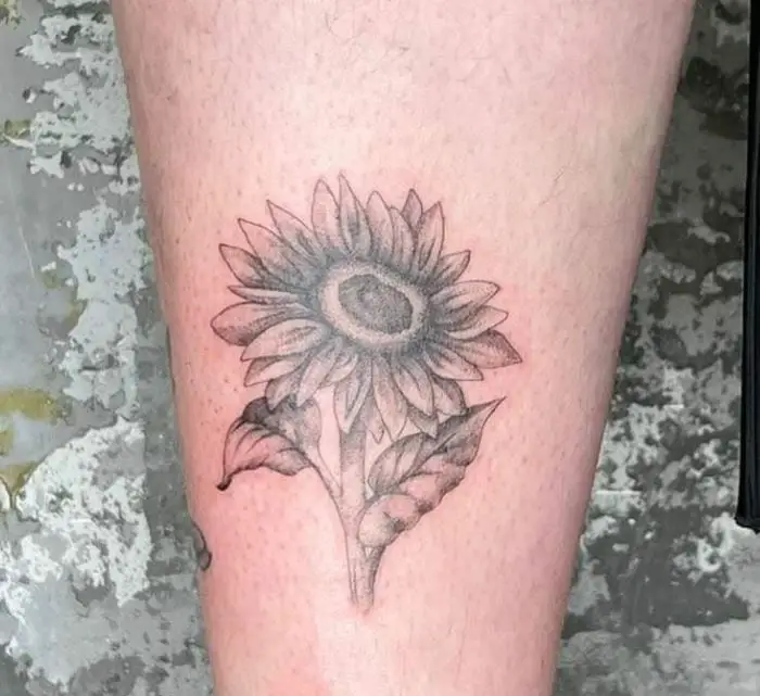 Sunflower tattoo in black and grey