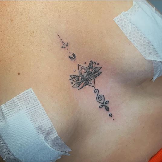 Super pretty sternum lotus tattoo