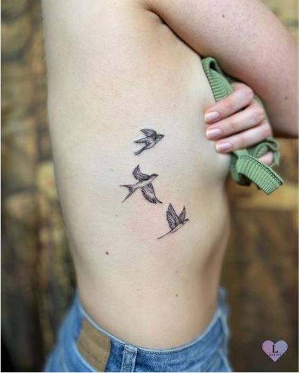Tiny Flying Birds Rib Tattoo