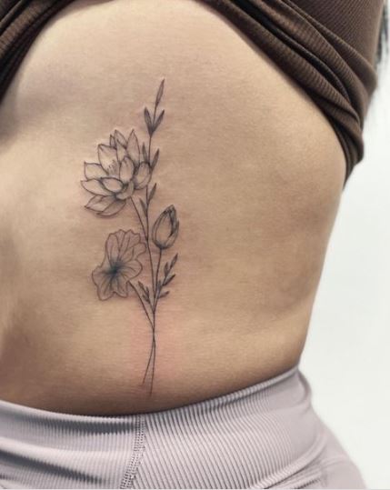 Water lily rib tattoo
