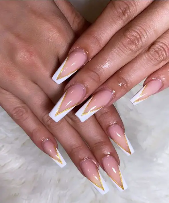 White and Gold V-tip nails