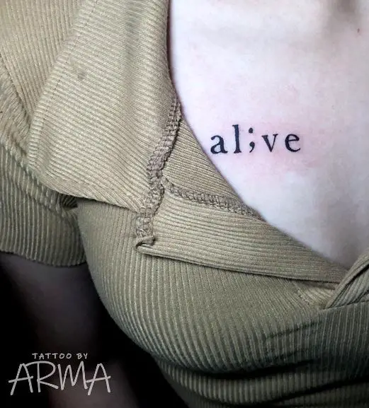alive chest tattoo with a semicolon