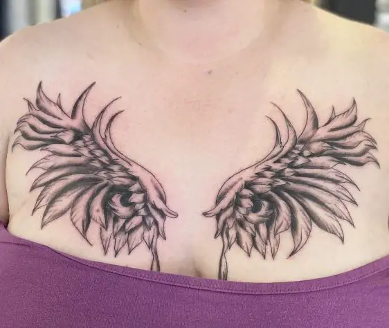 angel wings chest tattoo