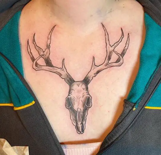 animal skull chest tattoo