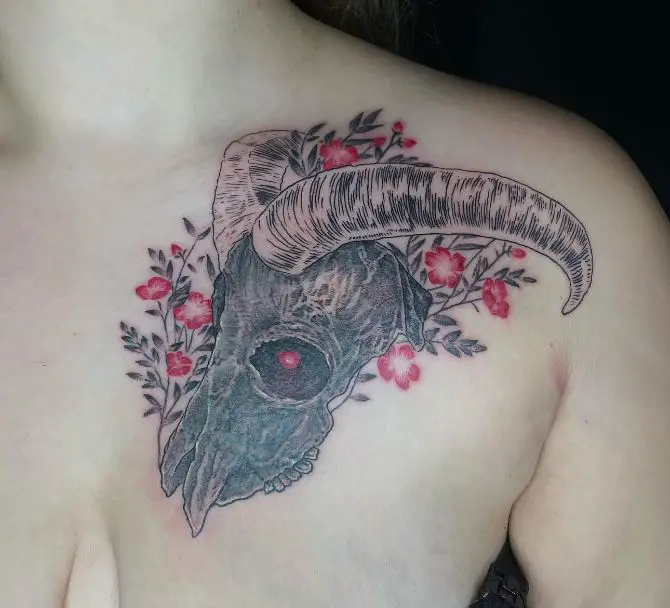 animal skull tattoo with pink flowers