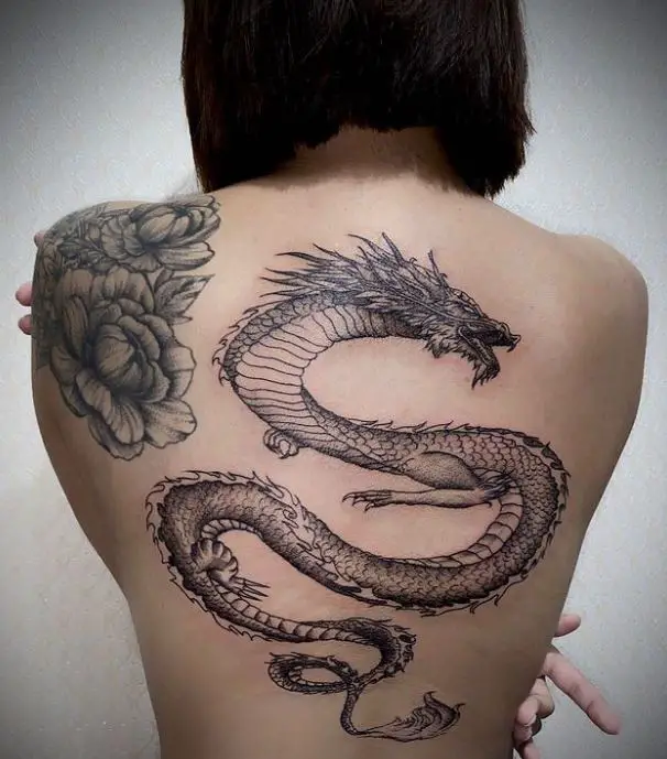 artistic feminine dragon back tattoo