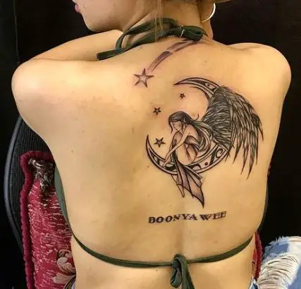 artistic moon and stars tattoo on the back