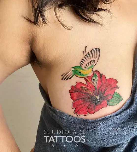 bird and flower chest tattoo